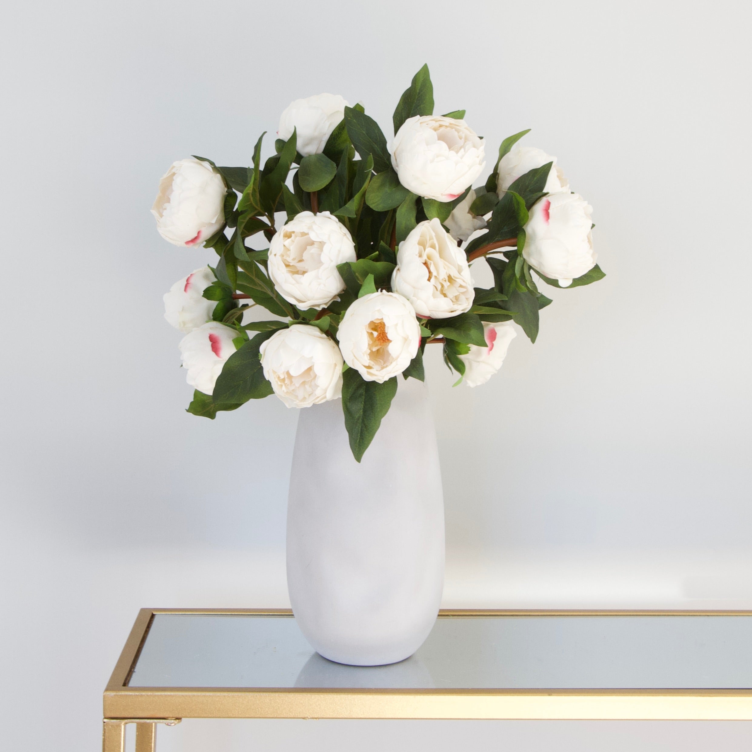 Luxury Lifelike Realistic Artificial Fabric Silk Blooms with Foliage Buy Online from The Faux Flower Company | 7 stems of White Real Touch Peony ABZ9148WH styled in Naunton Vase ABP525B