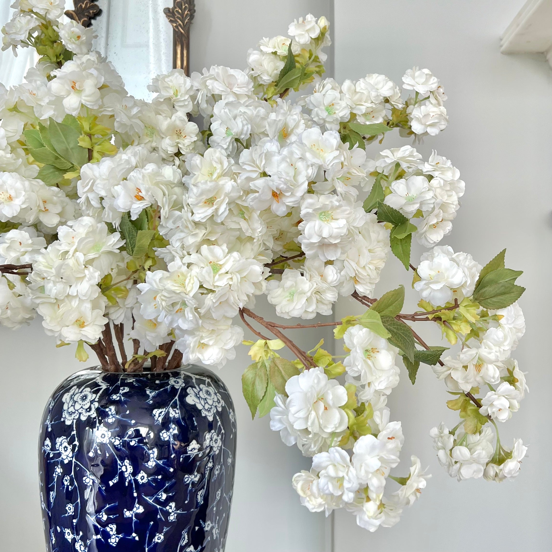 Luxury Lifelike Realistic Artificial Flowers Fabric Silk Luxury Flower Stem Silk Flower Arrangement White Cherry Blossom with Foliage in Blue Flower Oriental Ceramic Vase Buy Online from The Faux Flower Company Trade Wholesale Bulk Buy ABY5043WH