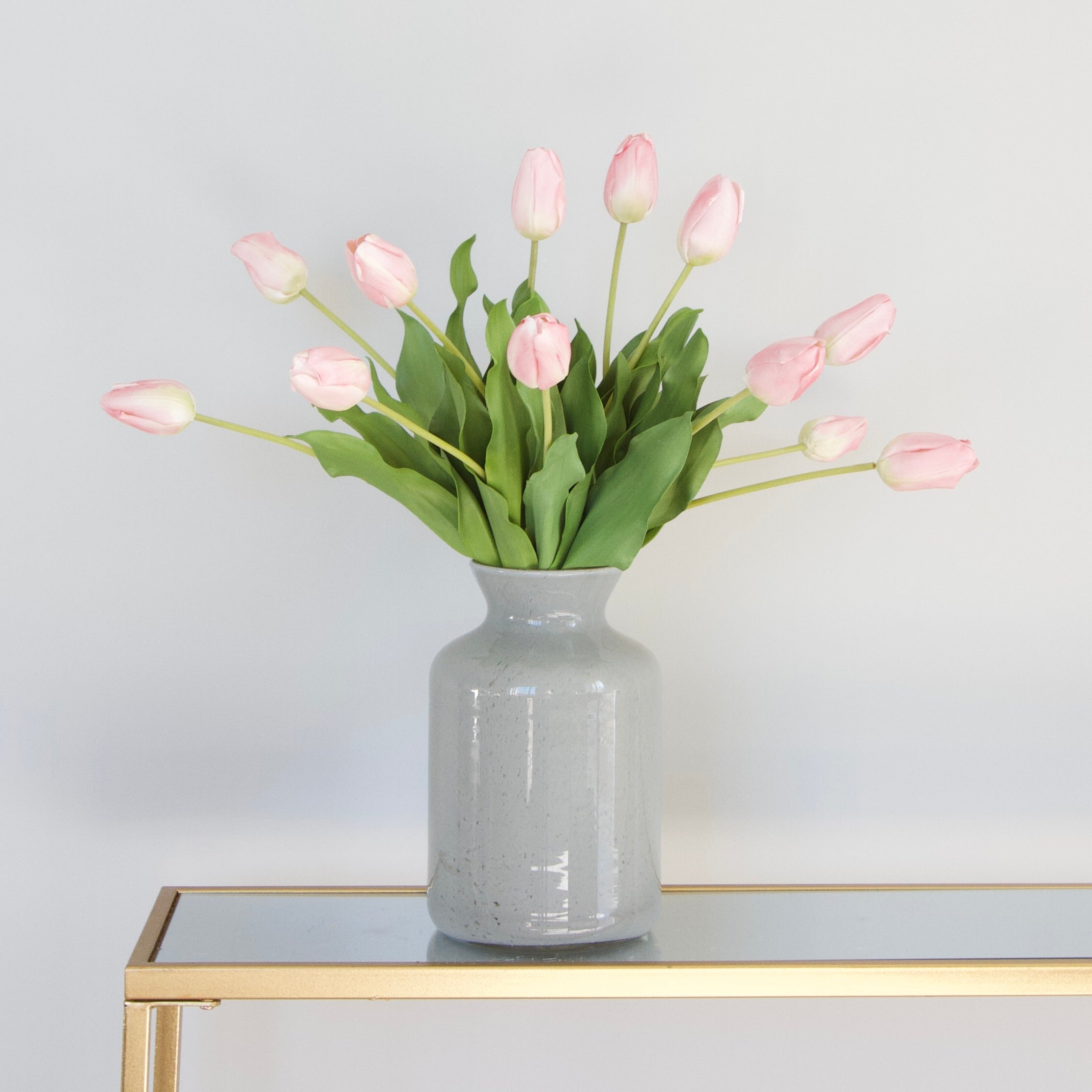 Luxury Lifelike Realistic Artificial Fabric Silk Blooms with Foliage Buy Online from The Faux Flower Company | 12 stems Pink Tulip ABY5657PK styled in Large Grey Funnel Neck Vase ABV0144